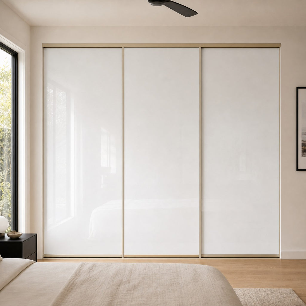 Installed super white glass sliding wardrobe doors